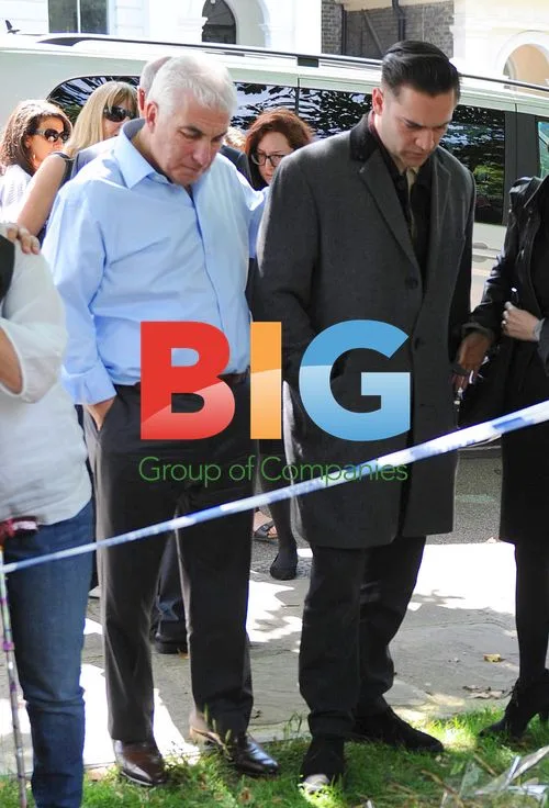 Mitch and Janice Winehouse Pay Respects