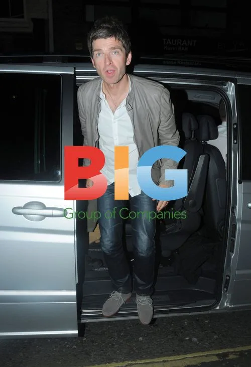 Noel Gallagher and wife Sara arrive at club