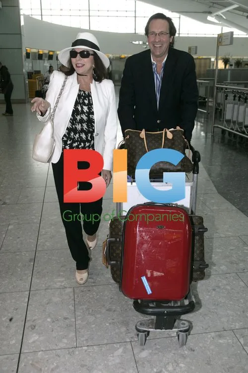 Joan Collins and Percy Gibson at Heathrow
