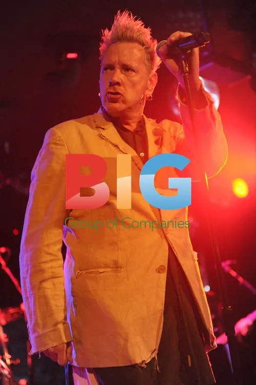 Johnny Rotten Performs With Drink