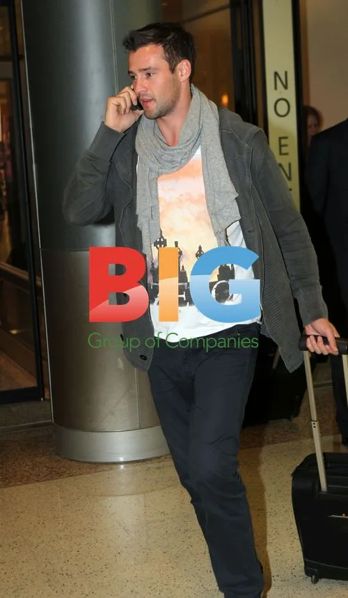 Kris Smith Arrives at Sydney Airport