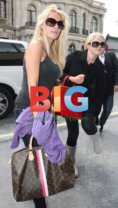 Hugh Hefner and Girlfriends Arrive in London