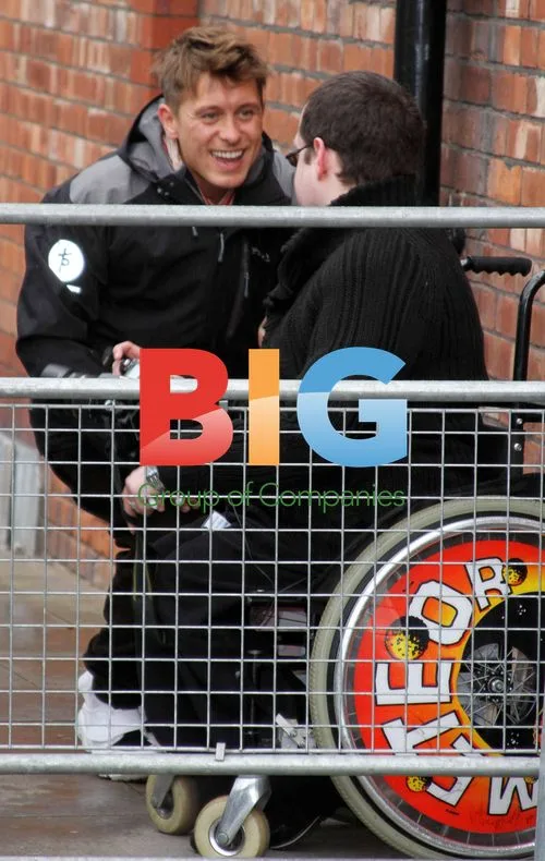 Mark Owen Signs Fan's Wheelchair