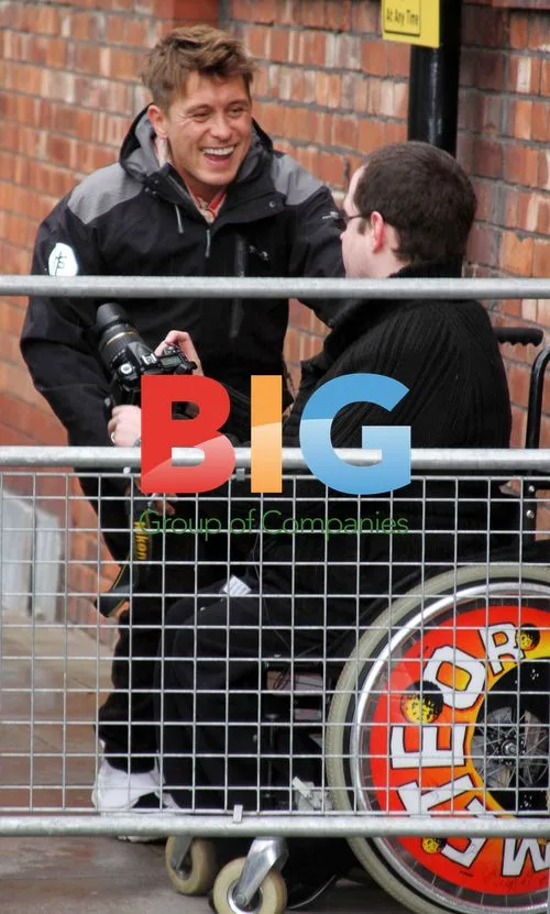 Mark Owen signs fan's wheelchair