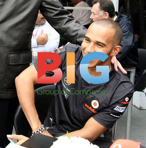 Andrew Bynum Meets McLaren Execs at F1 Race