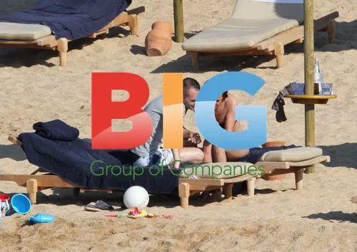 Andres Iniesta and wife on Sardinia beach
