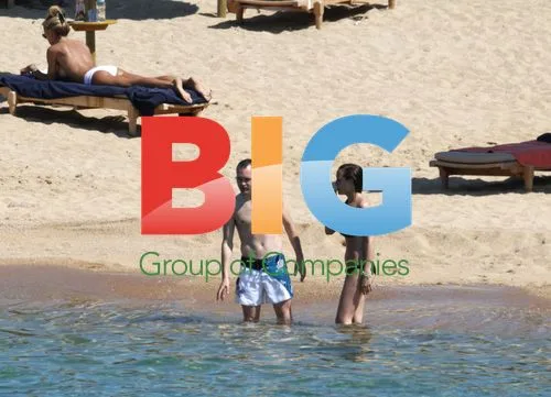 Andres Iniesta and wife on Sardinia beach