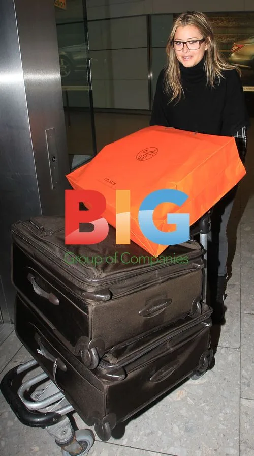 Celebs Arrive from Oscars at Heathrow