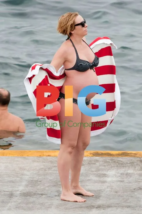 Toni Collette shows off baby bump in Sydney