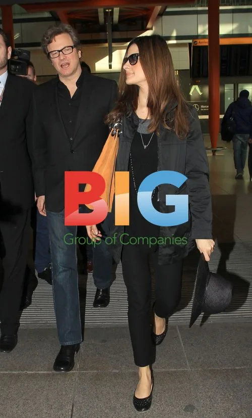 Colin Firth and wife at Heathrow