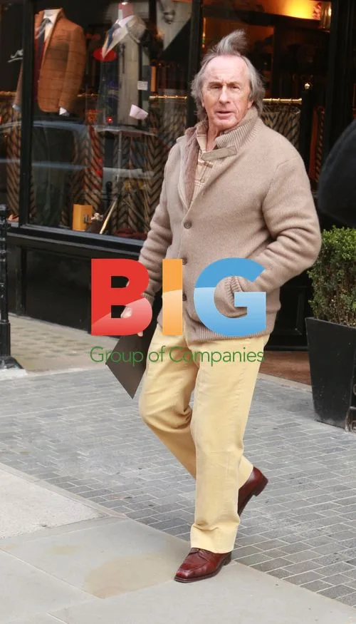 Jackie Stewart Leaves Clothing Shop in London