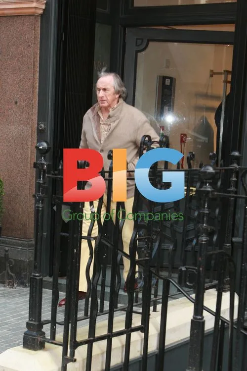 Jackie Stewart Leaving Clothing Store