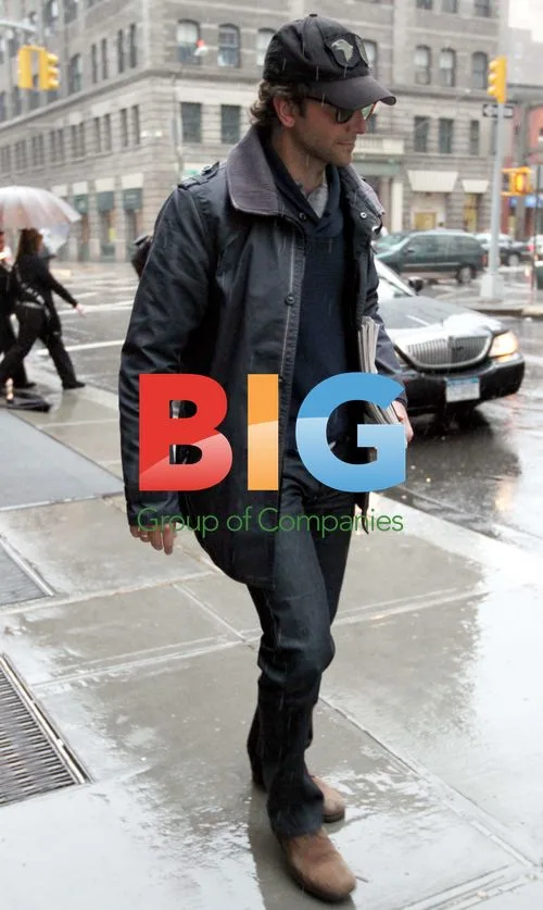 Bradley Cooper braves the rain in New York