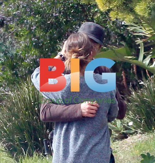 Robert Downey Jr. and Susan Levin kiss during stroll
