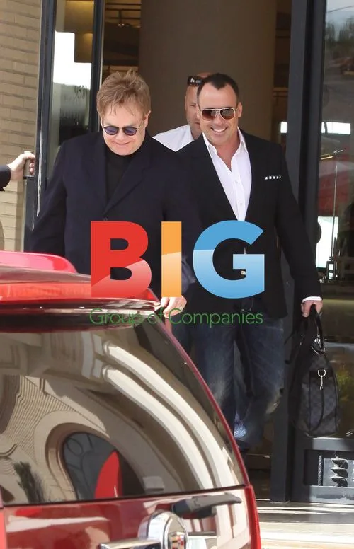 Elton John and David Furnish shopping at Barneys