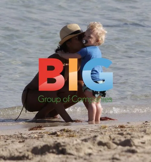 Amadeus Becker plays on beach with nanny