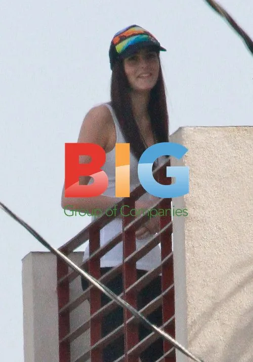 Ali Lohan and brother Cody Lohan on balcony