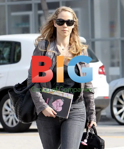 Elizabeth Berkley holding notebook in LA