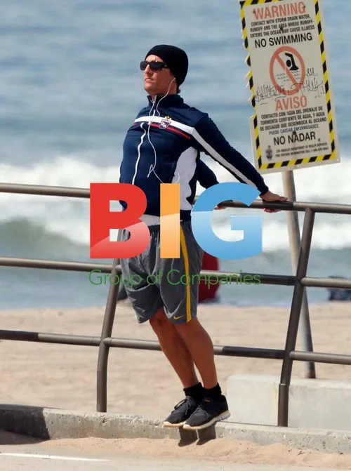 Matthew McConaughey stretching on Malibu beach