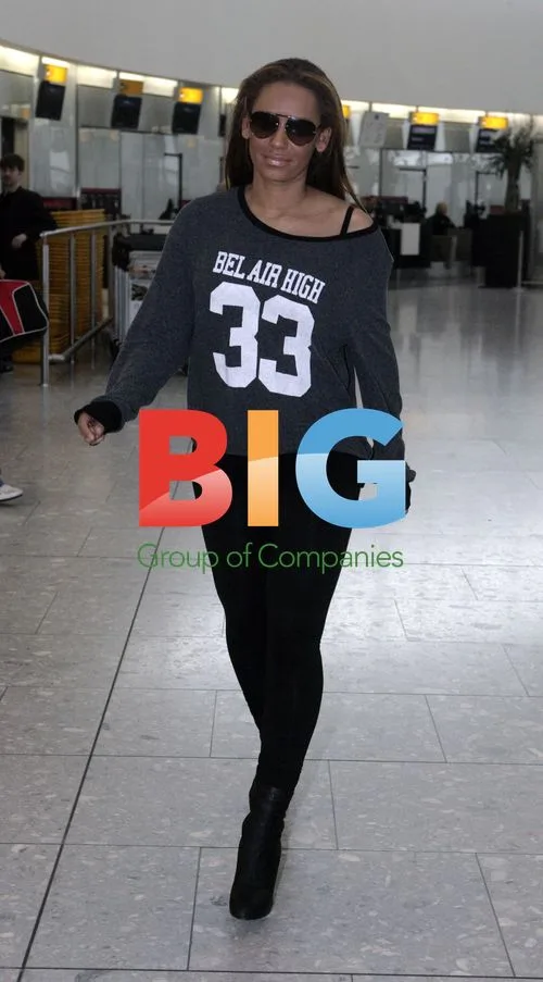 Mel B Spotted at Heathrow Airport