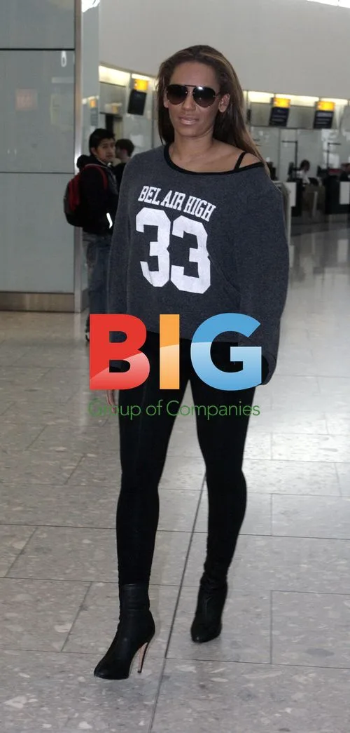 Melanie 'Mel B' Brown Spotted at Heathrow Airport