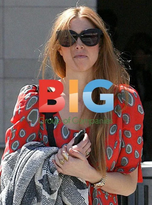 Whitney Port in Orange Outfit