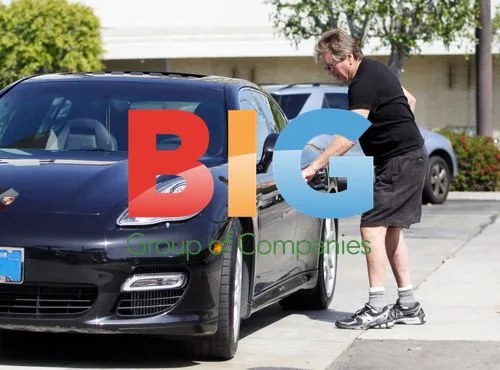 Ryan O'Neal at gas station with Porsche