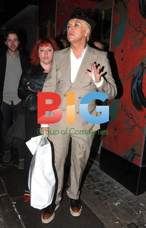 Steve Strange and girlfriend leaving birthday party