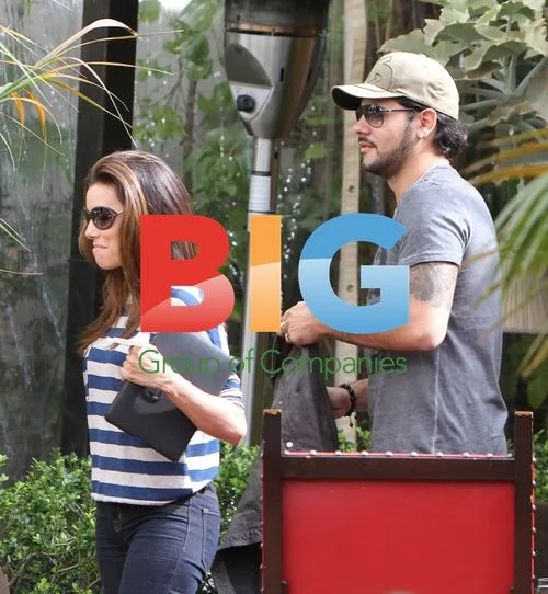 Eva Longoria and Eduardo Cruz kiss at Chateau Marmont