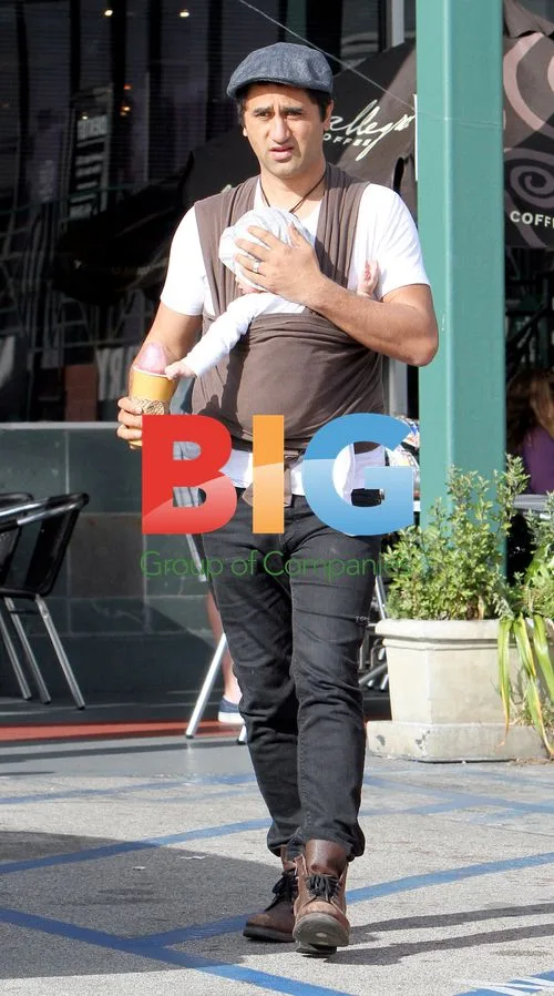 Cliff Curtis on baby duty at Whole Foods