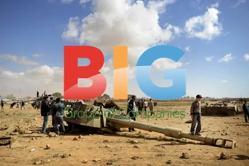 People climb on Gaddafi's tanks in Benghazi