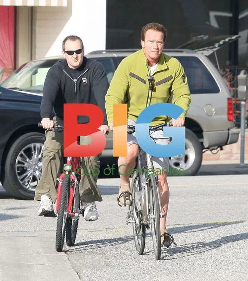 Arnold Schwarzenegger Biking with Friend