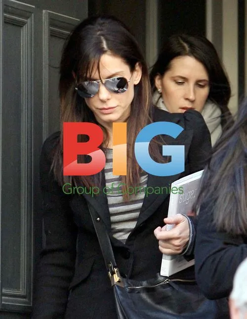 Sandra Bullock Leaving Home with Cookbook