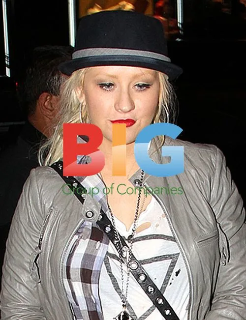 Christina Aguilera poses with fan in NYC