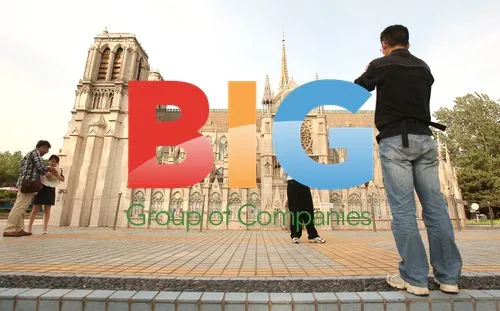 Tourist poses at Notre Dame replica in Beijing