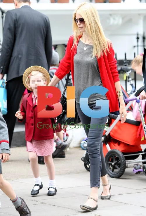 Claudia Schiffer on school run in London