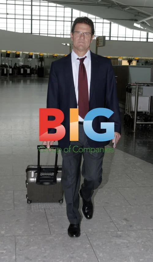 Fabio Capello departs Heathrow