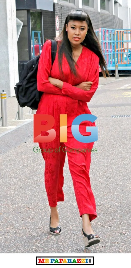 V.V. Brown in Red Jumpsuit
