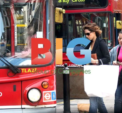 Alex Jones Waits for Bus in London