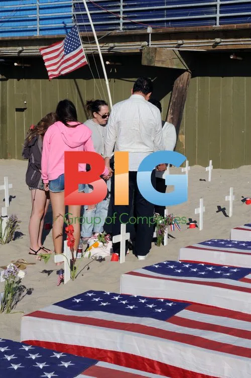 People Pray at Arlington West Memorial