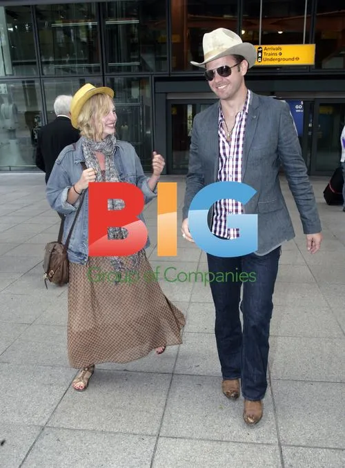 Matt Davis and Candice Accola at Heathrow Airport
