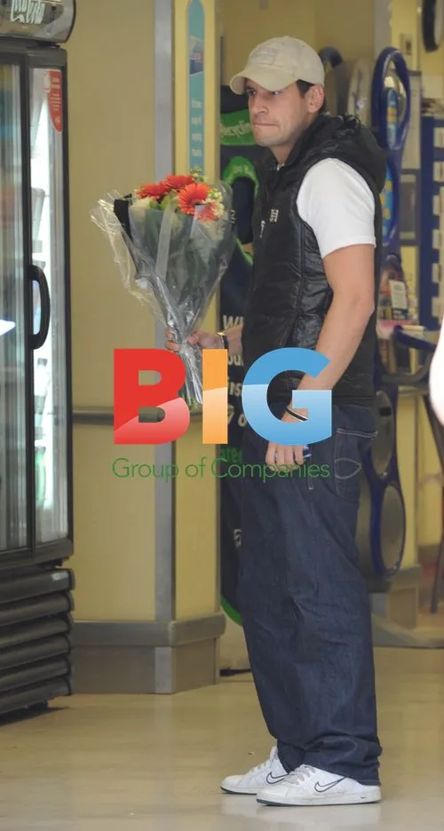 Greg Lake Leaves Tesco with Flowers