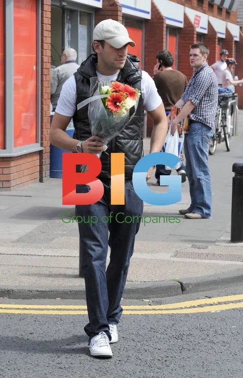 Greg Lake Leaves Tesco with Flowers