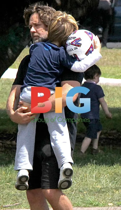 Russell Crowe plays football with sons