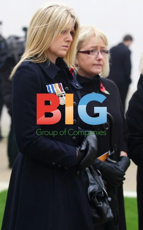 Gemma Polino lays flowers at Armistice Day memorial