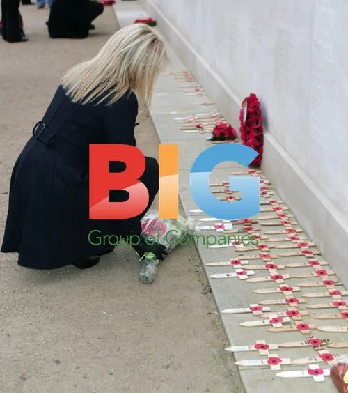 Gemma Polino lays flowers at Armistice Day memorial