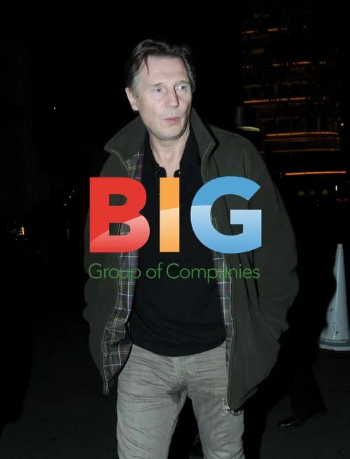 Liam Neeson leaves Scotts with friend