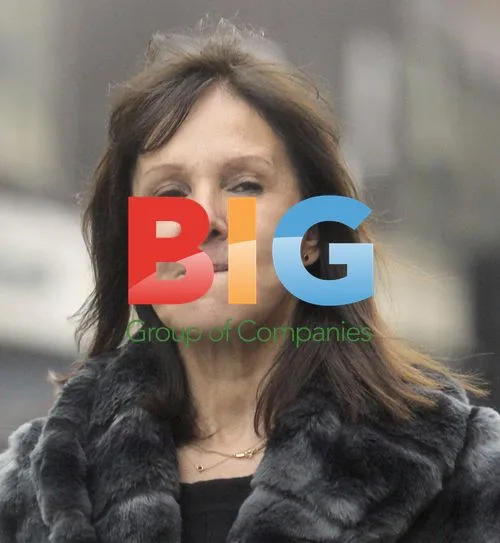 Arlene Phillips waits for car outside London hotel
