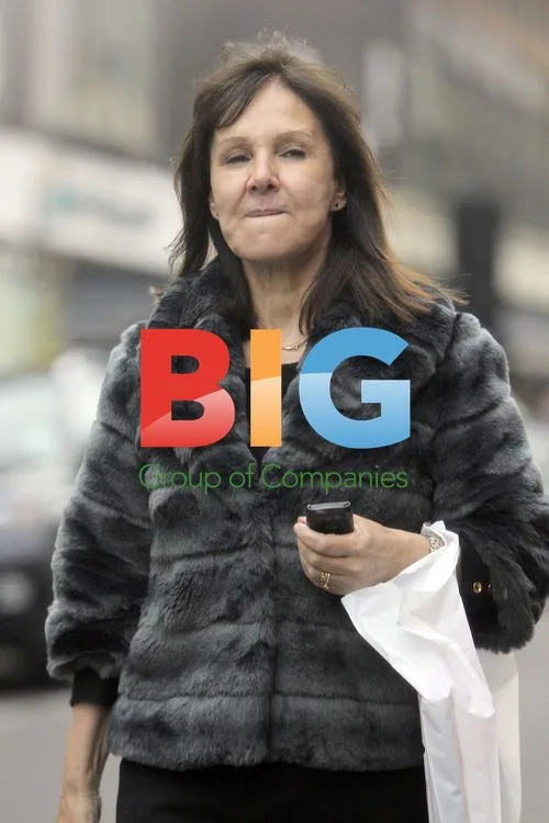 Arlene Phillips Waits for Car Outside Hotel