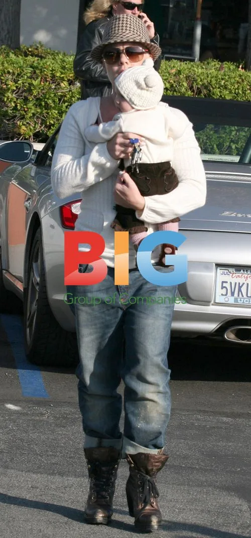Pink carries baby Willow in Malibu park